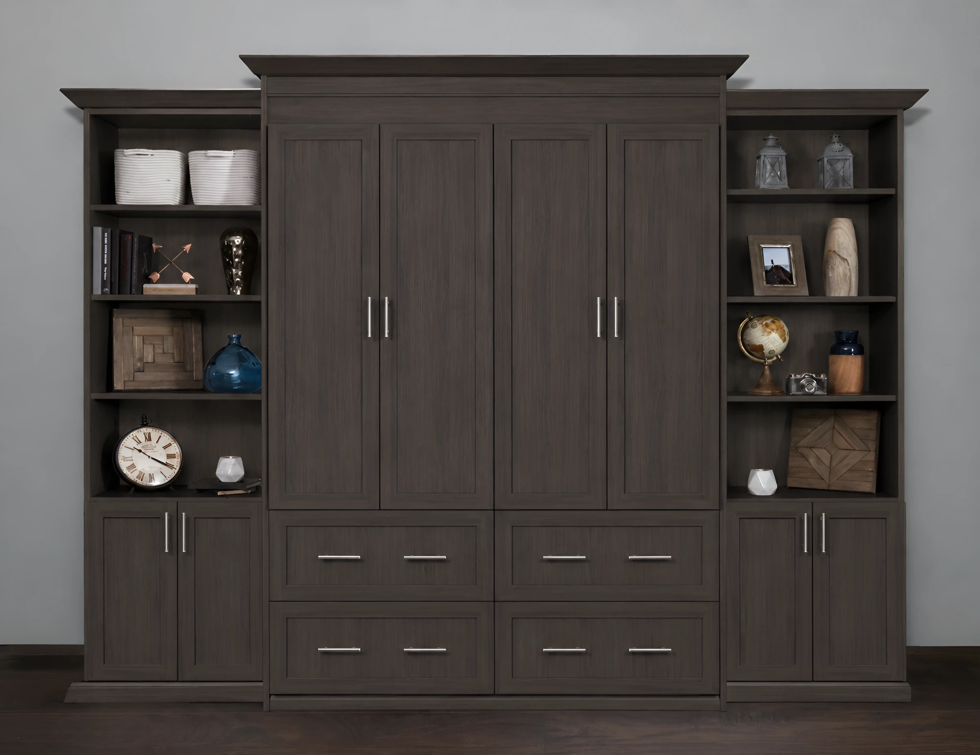Grey walnut murphy bed closed, with matching bookcase towers either side and a bank of deep drawers below